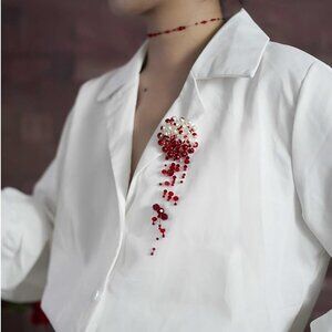 Blood pearl brooch